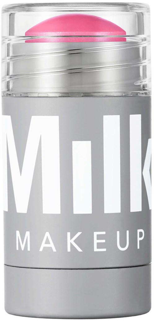 A silver and white container labeled "Milk Makeup" holds a pink beauty product on top.