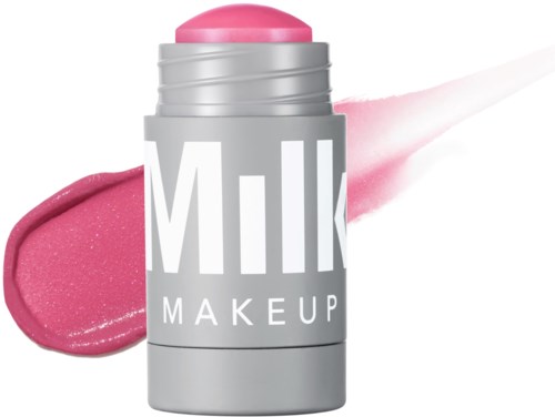 A cosmetic stick with pink blush. It has a silver container and the words 'Milk Makeup' on it.
