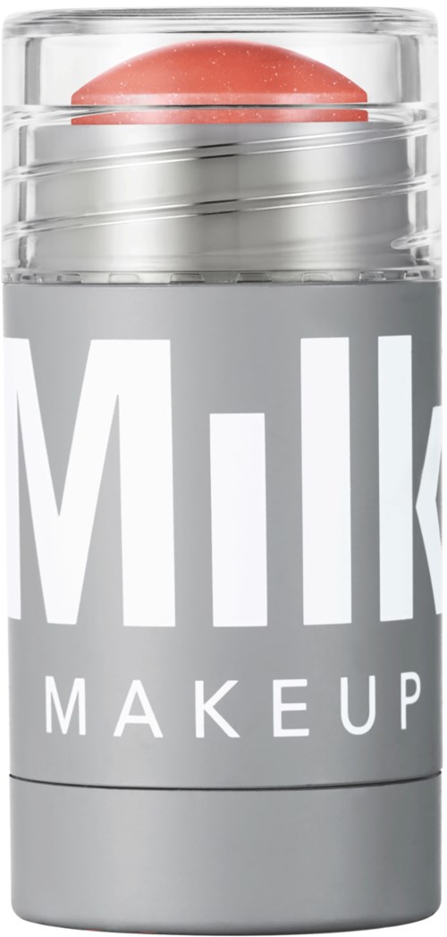Een grijze container met de woorden 'Milk Makeup' en een roze object binnenin, gedeeltelijk zichtbaar boven de deksel.