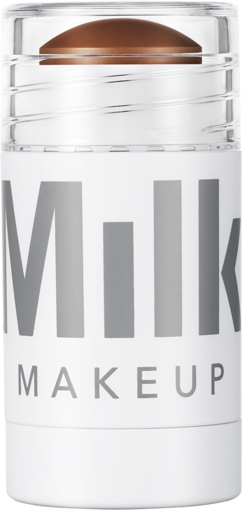 Een cilindervormige container met een koperkleurig deksel en dikke tekst die 'Milk Makeup' zegt.