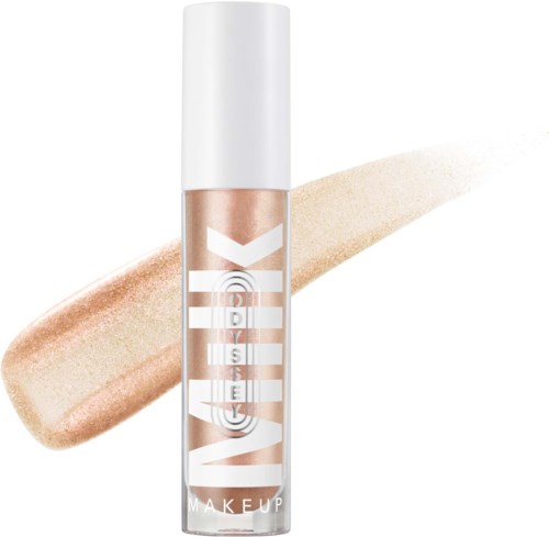 Vaseline makeup highlighter stick with a beige glow, standing upright, background white, and a swatch of gold shimmer.