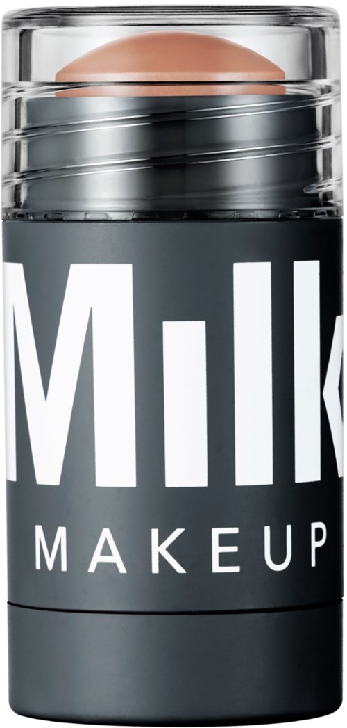Een make-upverpakking met de tekst "Milk Makeup" en een ronde bovenkant, deels zichtbaar grote tekst.