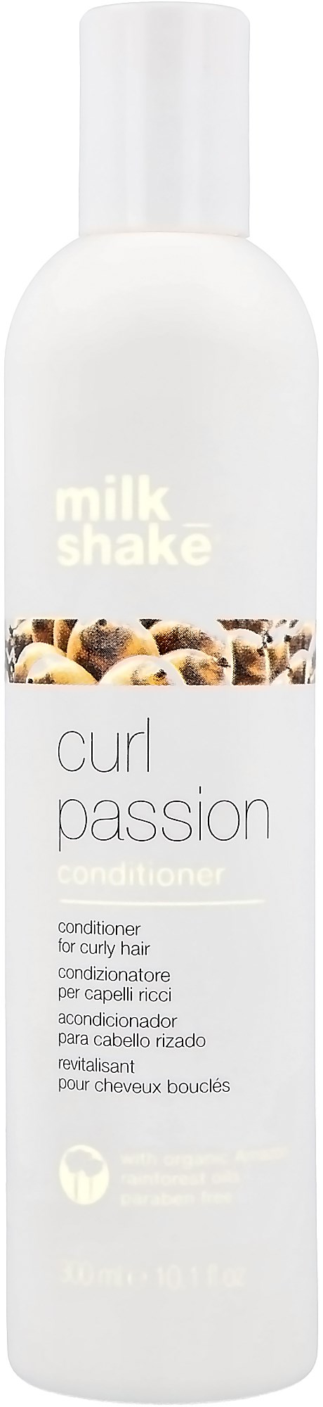 Een witte fles met 'milk shake' erop en een afbeelding van koffie en noten, voor krullend haar.