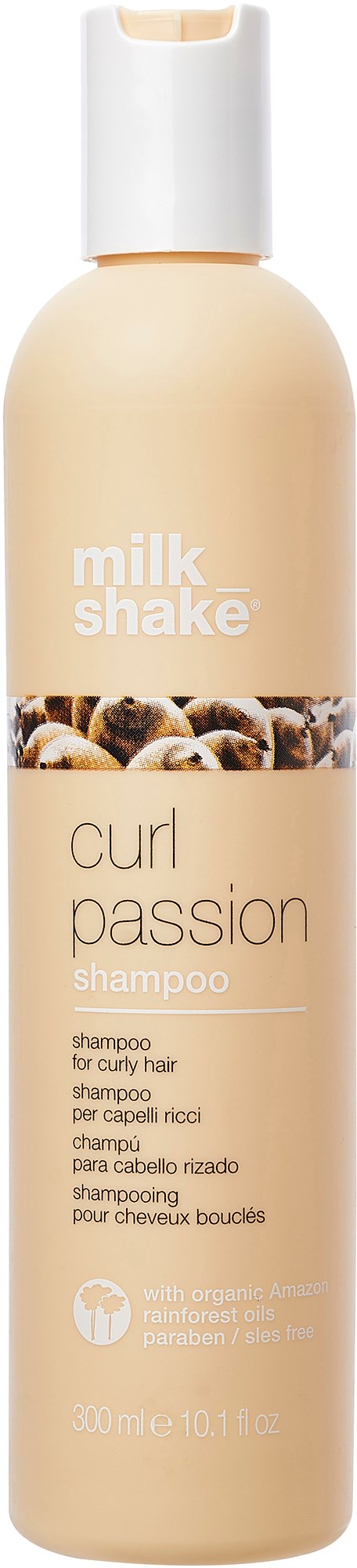Een shampoefles met label 'milk shake curl passion' voor krullend haar, witte dop en beige lichaam, met een klein afbeelding.