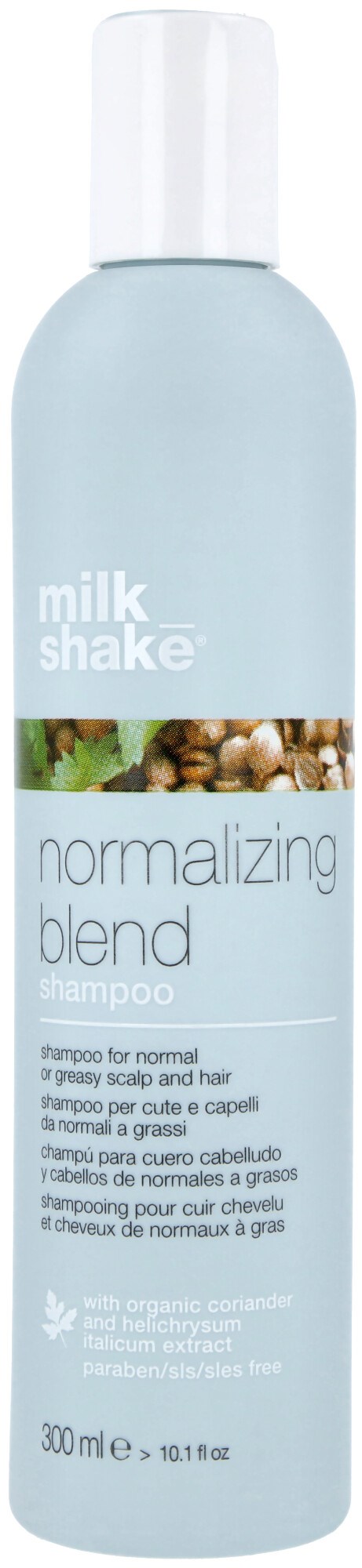 En høy, lys blå flaske med hvit lokk. Den heter 'milk shake' og er sjampo for hår.