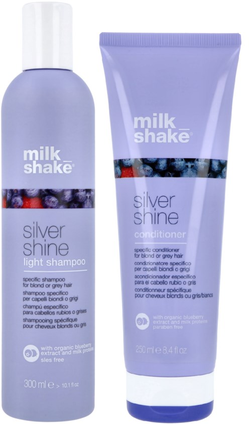 Twee haarverzorgingsproducten, een shampoo en een conditioner, in paarse flessen met "milk shake silver shine".