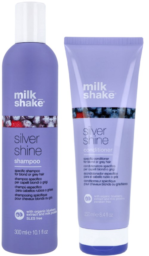Twee paarse haarverzorgingsproducten: een shampoo en een conditioner, beiden met 'milk shake' en 'silver shine.'