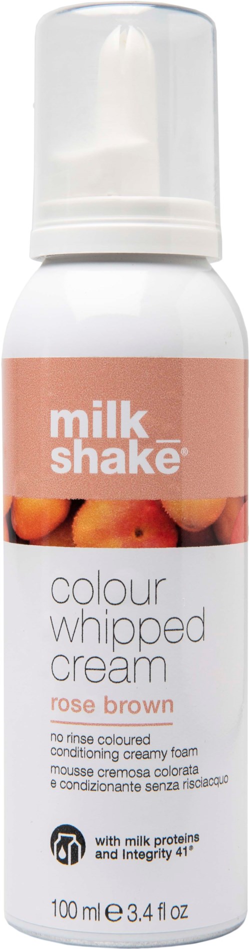 En vit flaska med pumpöverdel, märkt 'Milk Shake colour whipped cream' i rosa och vitt, med ett foto av bruna och rosa nyanser.