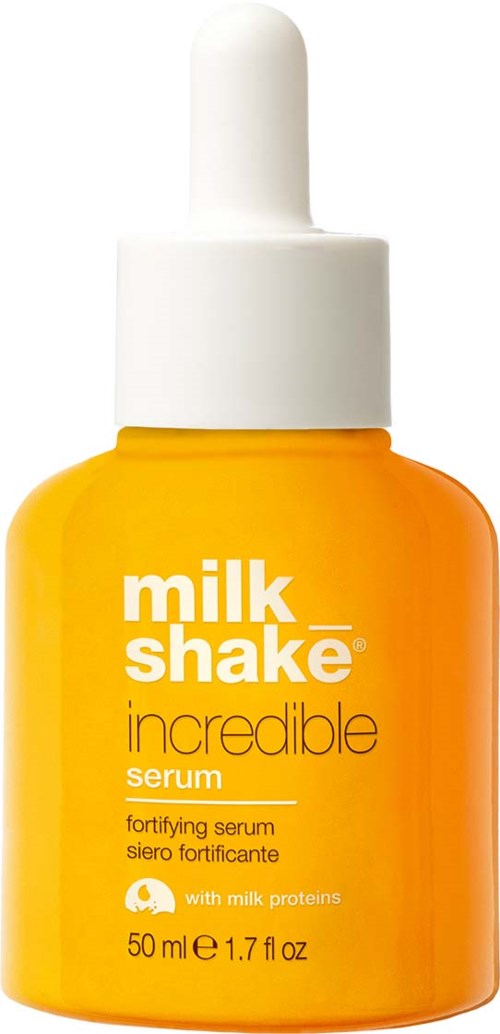 Eine gelbe Flasche mit weißem Tropferdeckel. Beschriftet als 'milk shake incredible serum' für Hautpflege.
