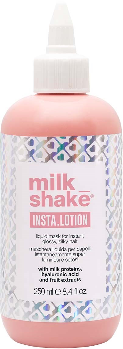 En rosa flaska med vit topp märkta 'milk shake' som innehåller en lotion för hudvård.