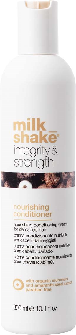 En hvit flaske med nærende balsam fra Milk Shake, merket 'Integrity & Strength,' med et svart-hvitt bilde av en hund.