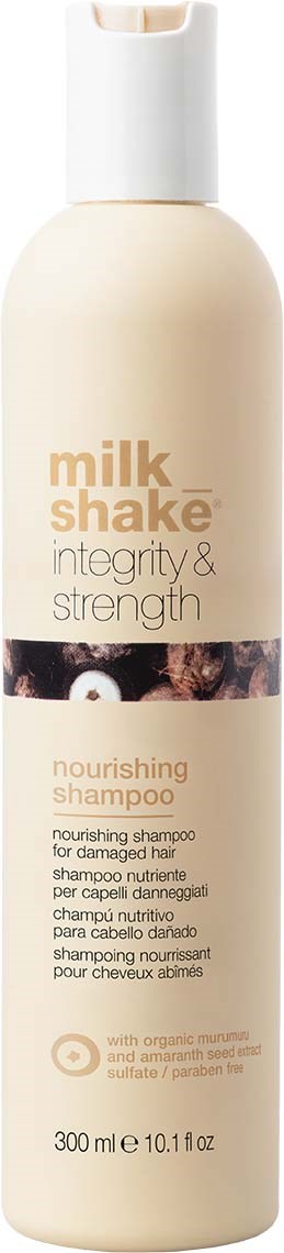 En flaske nærende sjampo merket 'milk shake' for skadet hår, med økologiske ingredienser og 300 ml innhold.