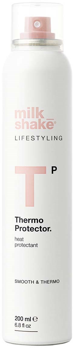 Een witte spuitbus met roze en zwarte tekst, gelabeld 'Milk Shake Lifestyle Thermo Protector' voor hittebescherming.