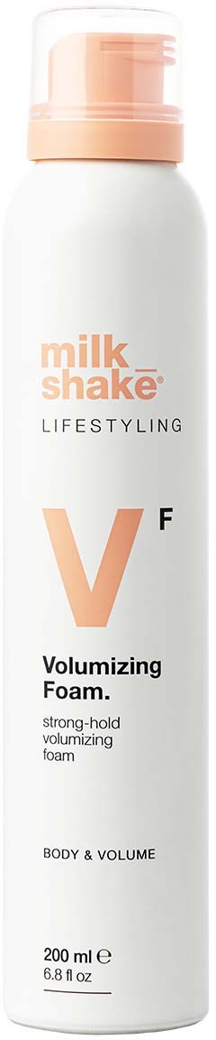 A white bottle with a pink cap, labeled as milk shake volumizing foam for body and volume, 200ml.