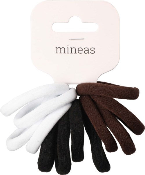 Six fabric hair ties in white, black, and brown colors hang from a card labeled "mineas."