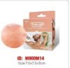 A pink Himalayan salt lamp with a wooden base and a box showing the salt lamp and its features.