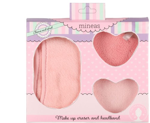 Een roze set make-up-verwijderaars en hoofdband in versierde verpakking met harten en strepen.