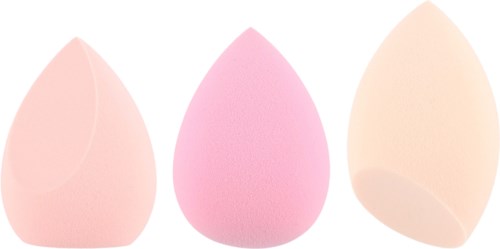 Three makeup sponges in different shades of pink and peach. They are soft and rounded, used for applying makeup.