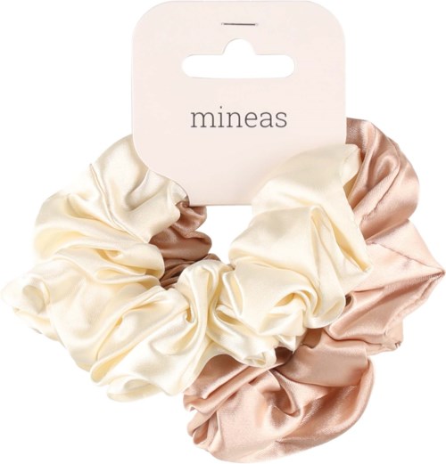 Ett set av siden hårsnoddar i färgerna creme, beige och rosa på ett kort som heter "mineas".