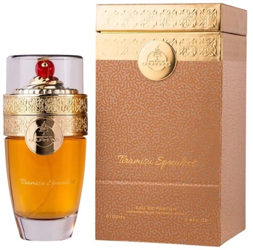 A perfume bottle with a gold design and a red top, next to its matching pink and gold box.