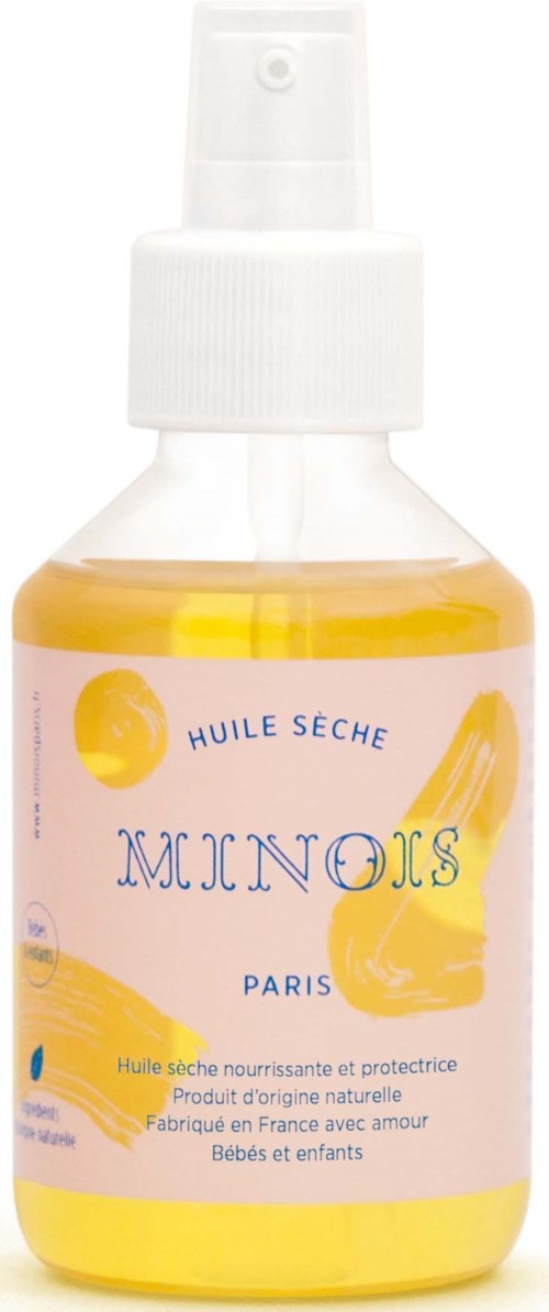 Kleine Sprühflasche mit gelber Flüssigkeit, beschriftet 'Huile Seche Minois Paris', für Babys und Kinder.