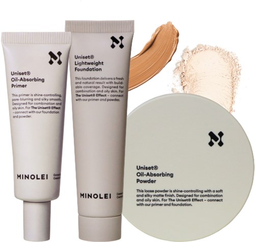 Tre Minolei makeup-produkter: primer, foundation och puder, med prov och krossat puder bredvid produkterna.