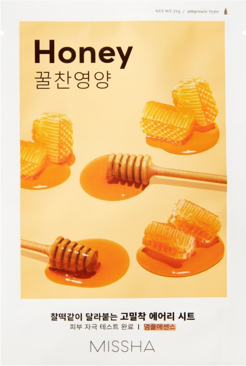 A honey product package with honeycombs, honey drizzles, and honey sticks. Text in English and Korean. Brand is MISSHA.