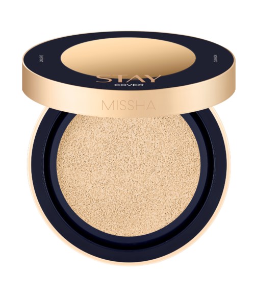 Rund kompakt med beige pudder inni og lokk merket "STAY COVER" og "MISSHA" i svart og beige.
