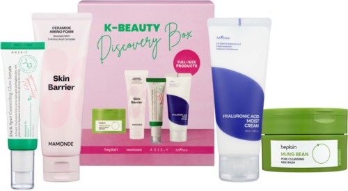 A skincare set with various products including creams, cleanser, and a box labeled K-Beauty Discovery Box.
