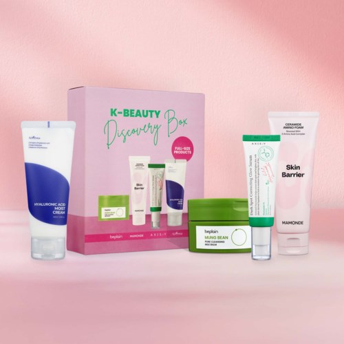 Set of skincare products including a tube, jar, and boxes in pastel colors, displayed against a pink background.