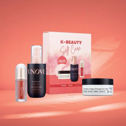 Samling av hudvårdsprodukter inklusive läppolja, hårolja, ansiktsmask och en box märkt K-Beauty Self Care.