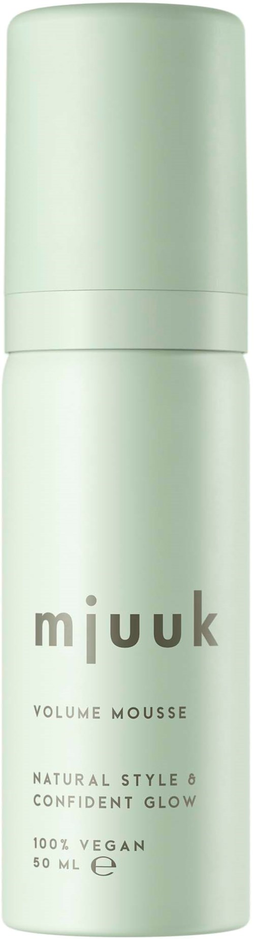 A light green cylindrical bottle labeled 'Mijuk Volume Mousse' for hair, with product benefits like natural style and confident glow.