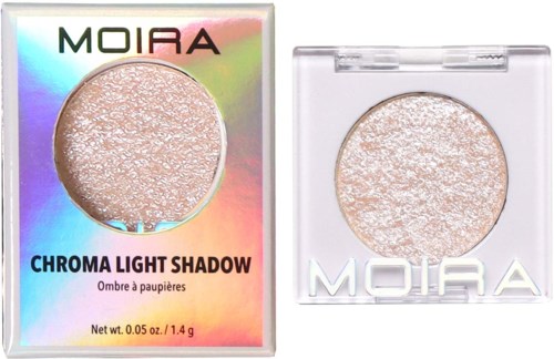 Holographic packaging shows a light-colored, shimmery eyeshadow from Moira with the label 'Chroma Light Shadow.'