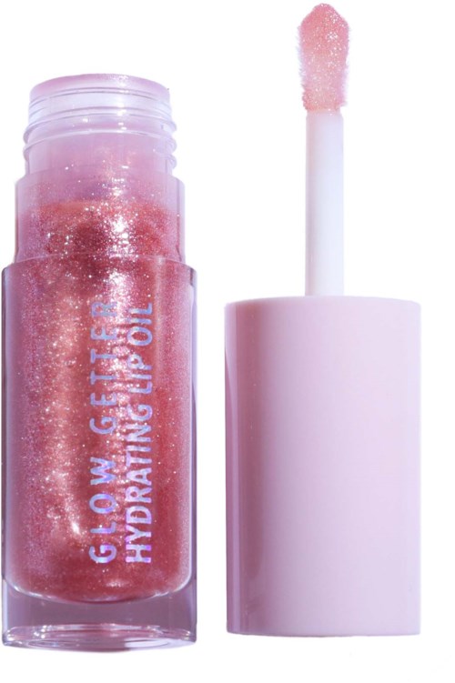Pink, glittery lip gloss tube with an applicator wand next to it.