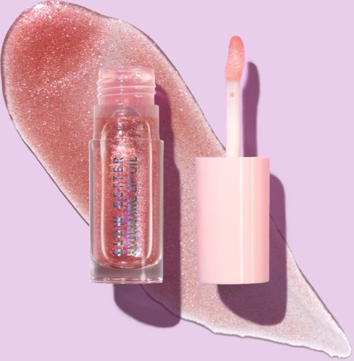 Pink glitter lip gloss bottle with applicator on lavender background, shiny glitter smear behind.