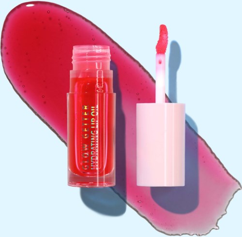 Lip gloss tube with pink applicator in front of pink lipstick mark on blue background.