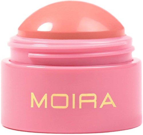 Pink cosmetic container with yellow text reading 'MOIRA' and a rounded lid.