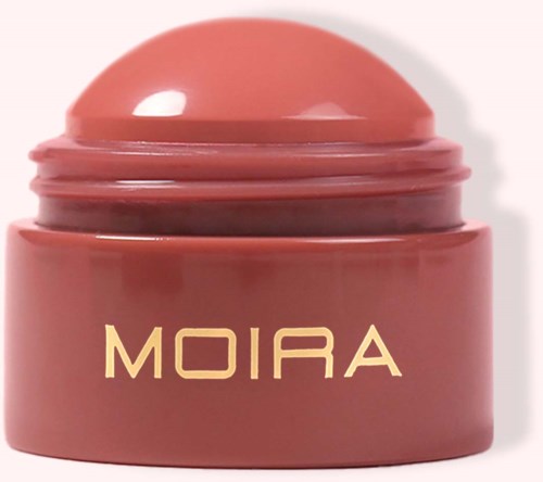 Pink jar with a round lid labeled 'MOIRA'. It appears to be cosmetic or skincare product packaging.