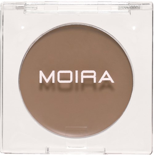 A round, beige makeup product in clear plastic packaging with the word 'MOIRA' on it.