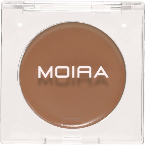 A compact makeup item labeled 'MOIRA' with light brown color inside. It appears to be a powder or blush.
