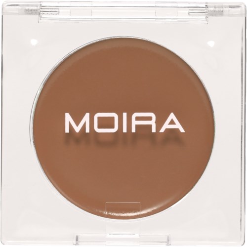 A round brown cosmetic product labeled 'MOIRA' in a clear plastic compact container.