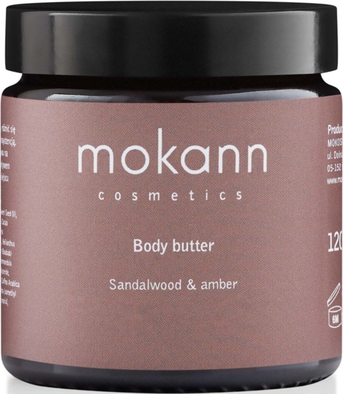 Ein pinker Behälter mit schwarzem Deckel, beschriftet mit 'mokann cosmetics' und 'Body butter' mit Sandelholz- und Amberduft.