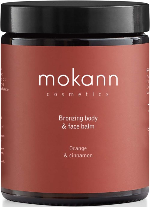 Ein Glas Bronzing Body & Face Balm von Mokann Cosmetics mit Orangengeruch und Zimtnote.