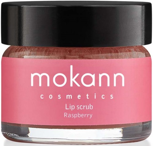 Ein kleiner Behälter mit Himbeeren-Lippenpeeling von Mokann Cosmetics mit rosa Etikett und schwarzem Deckel.