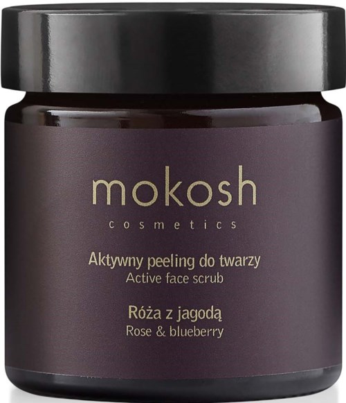 Een donkerpaars potje met een zwarte deksel. Label zegt Mokosh cosmetics, actieve gezichtspeeling met roos en bosbes.