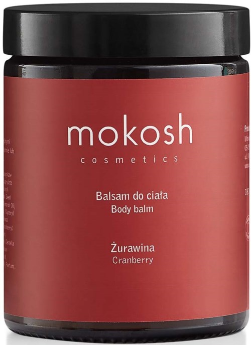 Een pot Mokosh lichaamsbalsem met rood label en zwarte deksel, tekst over cranberry geur.