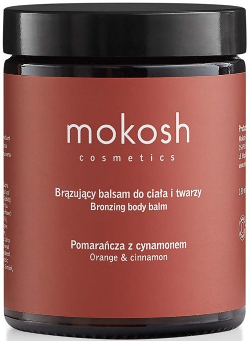 Een bruin potje met bronserende lichaamsbalsem met zwarte deksel, gemerkt 'mokosh cosmetics' en geur 'Orange & cinnamon'.