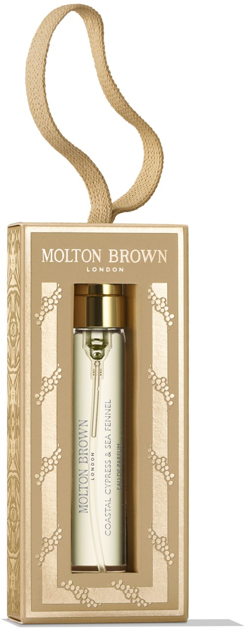 En parfymeflaske med gullhette i en dekorativ beige eske, hengende med et beige bånd, merket 'Molton Brown.'