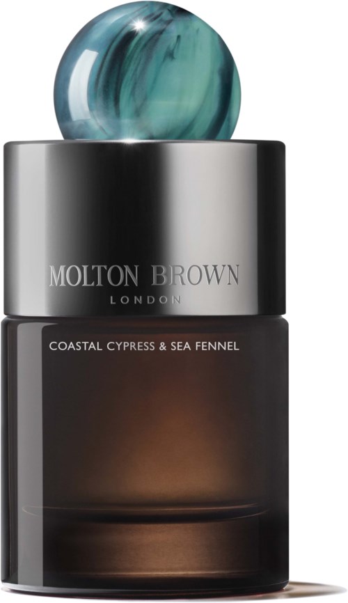 Eine Molton Brown Parfümflasche mit Marmor-Deckel, dunkles Glas, silberner Ring und Duftbeschreibung.