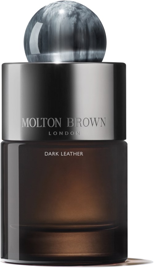 Eine Molton Brown London-Flasche mit dem Etikett Dark Leather, mit einem glänzenden runden Deckel und dunklem eleganten Körper.